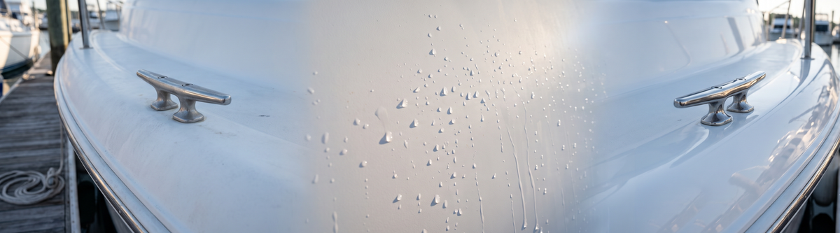 White boat's bow with polished cleats and water droplets on a glossy, oxidation-free gelcoat finish