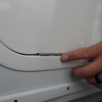 Saltwater salt buildup on a boat hull that Salty Dog boat salt remover prevents